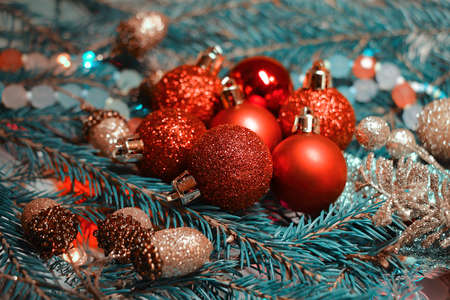 Christmas background with fir branches, balls and garlands. Tonal stylization in vintage style.の写真素材