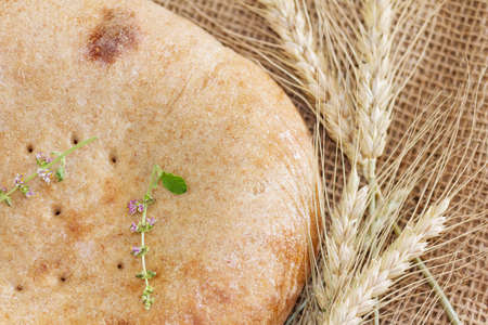 Homebaked bread. Yeast-free cake and ears. Ciabatta close up.の写真素材