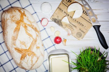 Fresh snack with camembert cheese on an old wooden tableの写真素材