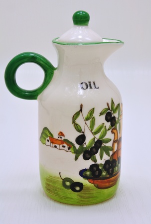 White ceramic container for oil with beautiful drawingsの写真素材