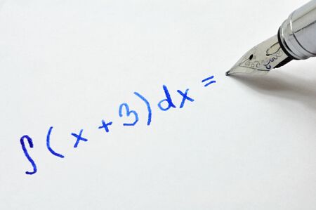 Mathematical example written in ink pen on white paperの写真素材