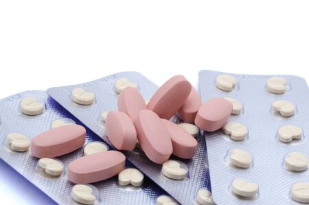 Many different colored drugs on the white background