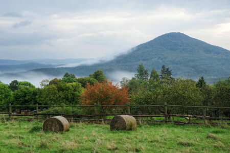 Autumn mist under the hill after sunset in the Czech Switzerlandの写真素材