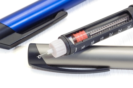 Insulin pen for diabetics on a clean white backgroundの写真素材