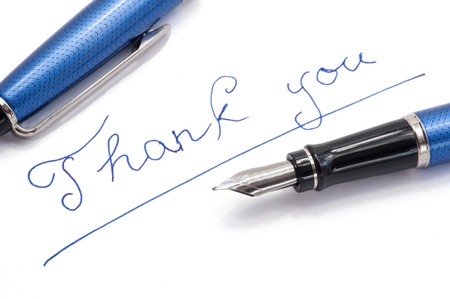 Thank you note on white background by blue inkの写真素材