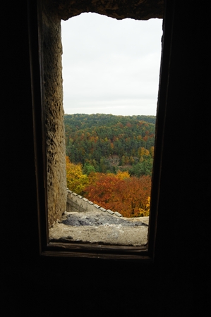 A view over the castle window to the autumn landscapeの写真素材