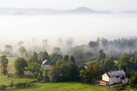 Beautiful foggy autumn landscape of czech switzerlandの写真素材