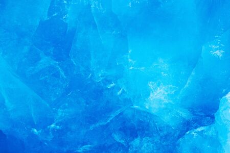 Blue ice wall. Blue ice and mountain. Winter Arctic. White snowy mountain, blue glacier Svalbard,...