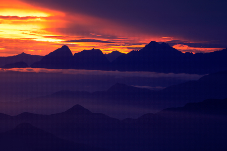 Santa Marta Mountain, Colombia. Looking down on Sierra Nevada de Santa Marta, high Andes mountains of the Cordillera, Colombia. Beautiful landscape with sun during sunset. Fog and clouds in the rock.の写真素材