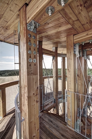 Wooden deck, ceiling, and poles on the top of outlook towerの写真素材