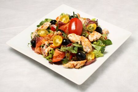 Chicken salad on the white plateの写真素材