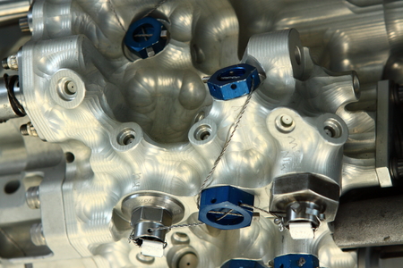 Very complex alluminum valve detail with blue nuts