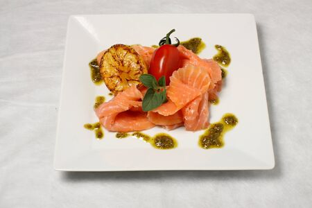 Salmon strips with roasted lemonの写真素材