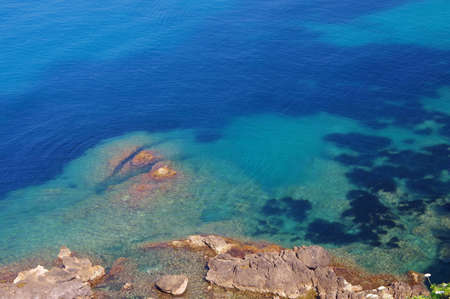 Blue mediterranean sea and rocksの写真素材