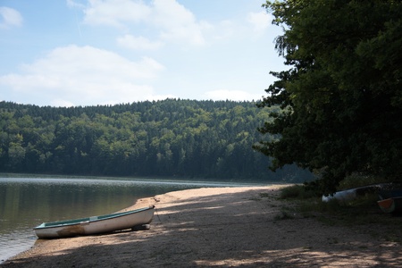 Rowboat on the summer beach damの写真素材