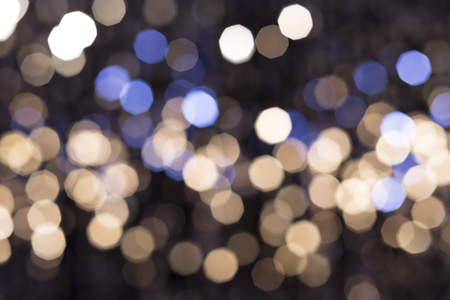 Abstract glittering lights, silver background, a real foto in the blurの写真素材