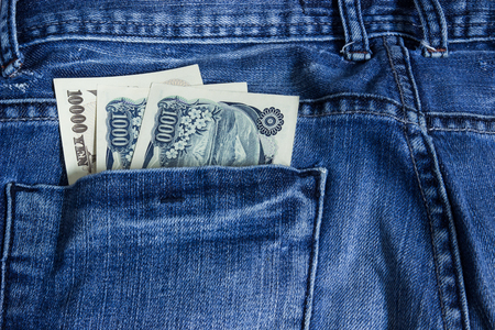 Japanese yen in jeans pocketの写真素材