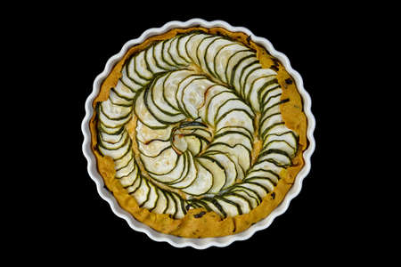 Zucchini pieces are laid out in a spiralの写真素材