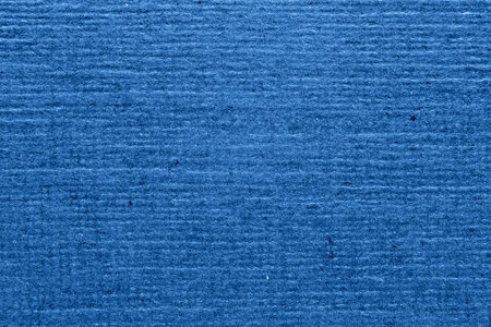 Blue textured paper background closeup. Striped grainy background for designの写真素材
