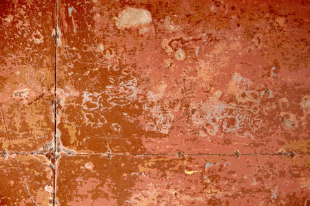 Texture of the old wooden brown painted floor with layers of rolled paintの写真素材