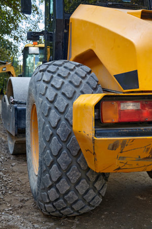 A fragment of road construction equipment close-up against the background of a construction site....