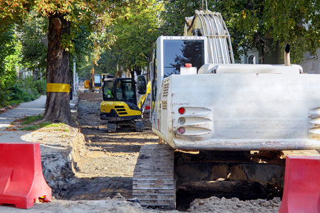 Road repair equipment on a construction site. White excavator body display mockup for promotional...