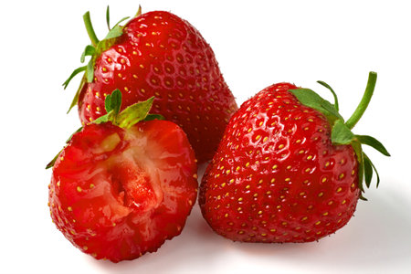 Fragrant ripe strawberry whole and bitten close-up isolated on a white background. Berry antioxidant.の写真素材