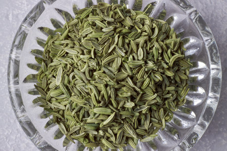 fragment of glass bowl with fennel seeds top viewの写真素材