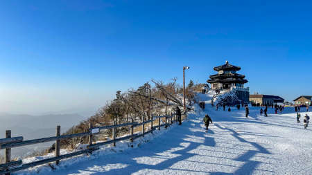 winter snow mountain landscape with blue sky and building in korea