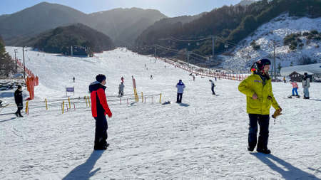 skiing in  snow mountain landscape with blue sky and building south korea and beautiful winterのeditorial素材