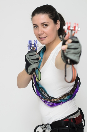 a young woman equipped with climbing gearの写真素材