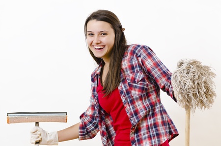 A smiling woman with a washer in her hands