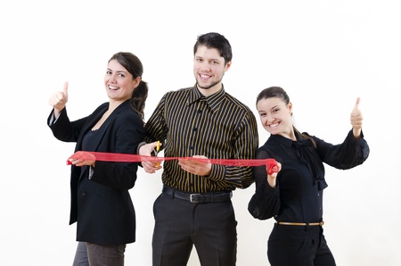 Business people cutting a red ribbonの写真素材