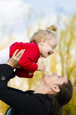 A young mother kissing her little babyの写真素材