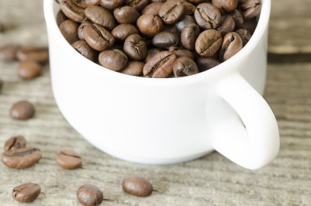 a coffee cup placed on woodの写真素材