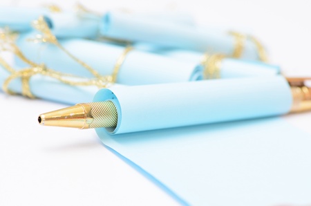 a pen and paper roll isolated on whiteの写真素材