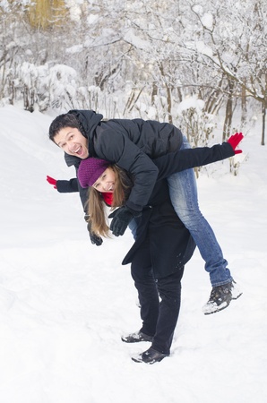 A nice couple playing in the snowの写真素材