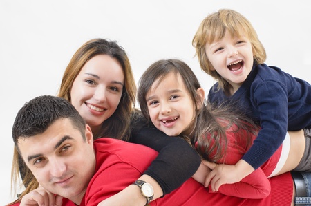A Family with three kids isolated on whiteの写真素材