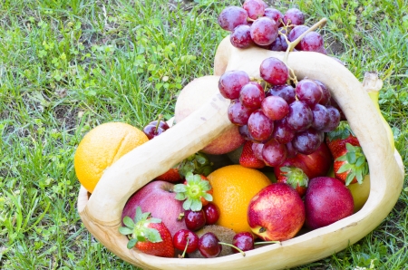 Rustic basket with fruitsの写真素材