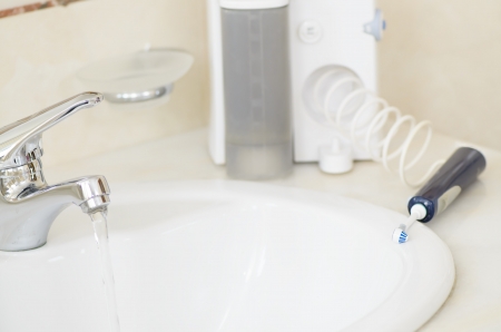 Oral irrigator in a bathroomの写真素材