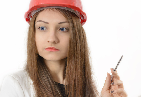 Portrait of female architect holding blueprintsの写真素材