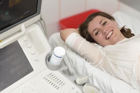 Young woman in hospital being examined with modern technology