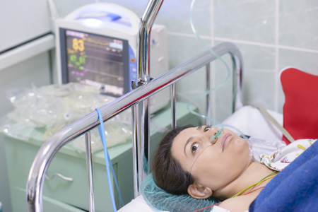 Woman being monitored in a recovery roomの写真素材