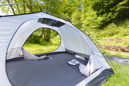 Touristic tent in a forest, summer dayの写真素材