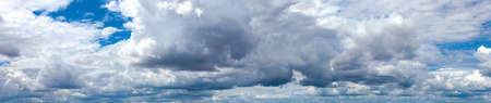Blue sky background panorama with clouds.