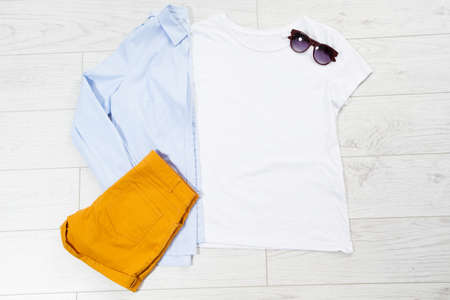 tshirt t-shirt t shirt mock up top view on wooden floor, clothes background copy space shirt flatlay