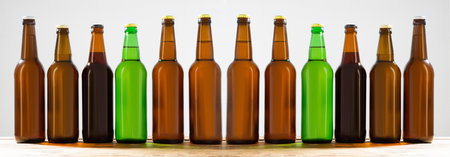 Beer bottles on a wooden table. Top view. Selective focus. Mock up. Copy space.Template. Blank.