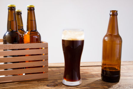 glass of beer on wooden table, top view. Beer bottles. Selective focus. Mock up. Copy space.Template. Blank.の写真素材
