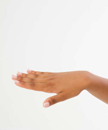 black Woman's hand with palm down. handbread isolated on a white background. front view. Mock up. copyspace. template. blank.の写真素材