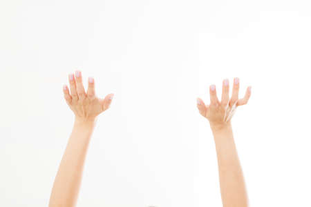 Two close woman hands isolated on white background. Copy space.の写真素材